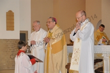 Bishop McGough reads the Post-Communion Prayer